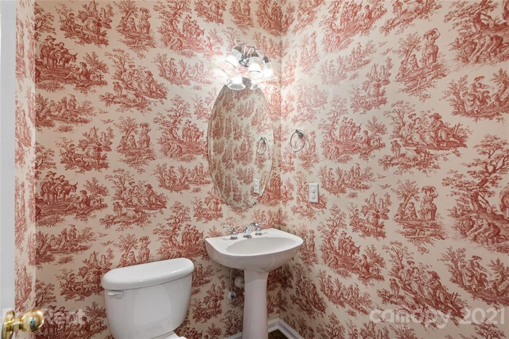 3028 Strawberry Road Matthews, NC 28104 - Photo 21 of 40 a bathroom with a toilet and a sink