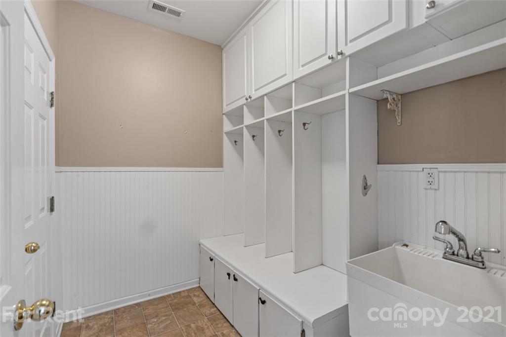 3028 Strawberry Road Matthews, NC 28104 - Photo 22 of 40 a bathroom with a tub a sink and a window