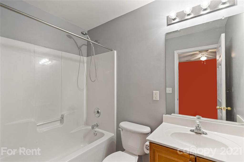 3028 Strawberry Road Matthews, NC 28104 - Photo 26 of 40 a bathroom with a sink toilet and shower