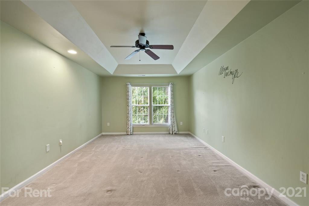 3028 Strawberry Road Matthews, NC 28104 - Photo 29 of 40 a view of room with a ceiling fan and window