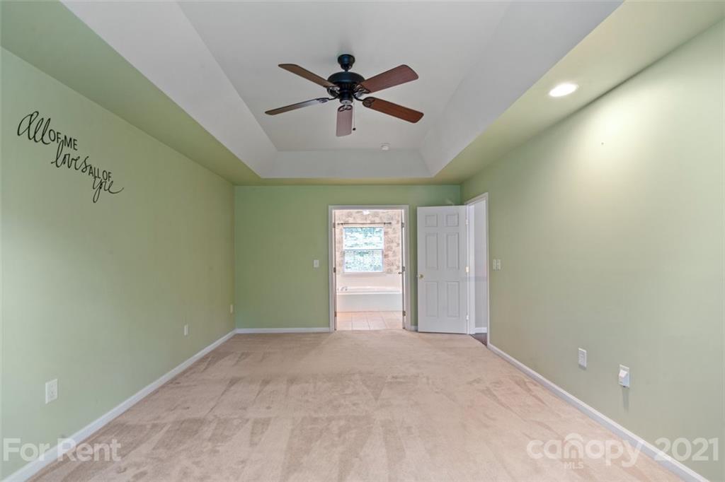 3028 Strawberry Road Matthews, NC 28104 - Photo 30 of 40 a view of a livingroom with a ceiling fan and window