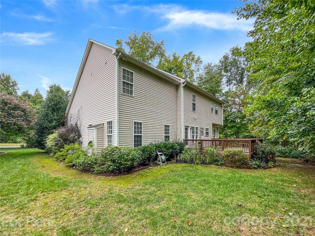 3028 Strawberry Road Matthews, NC 28104 - Photo 37 of 40 a view of a house with backyard and garden