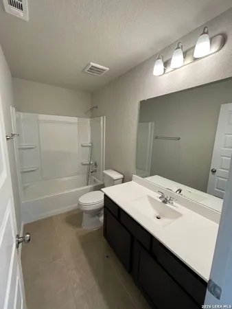 a view of empty room with a potted plant