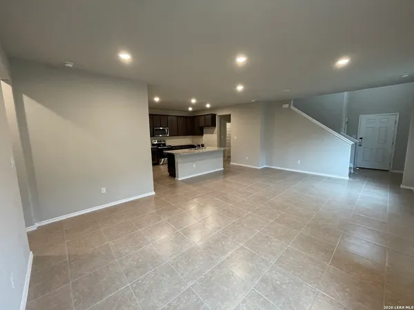 a view of a kitchen with a sink and cabinets