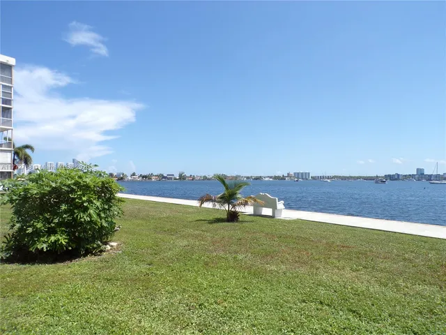 a view of a floor to ceiling window next to a yard