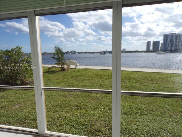 a view of a hallway with a chandelier