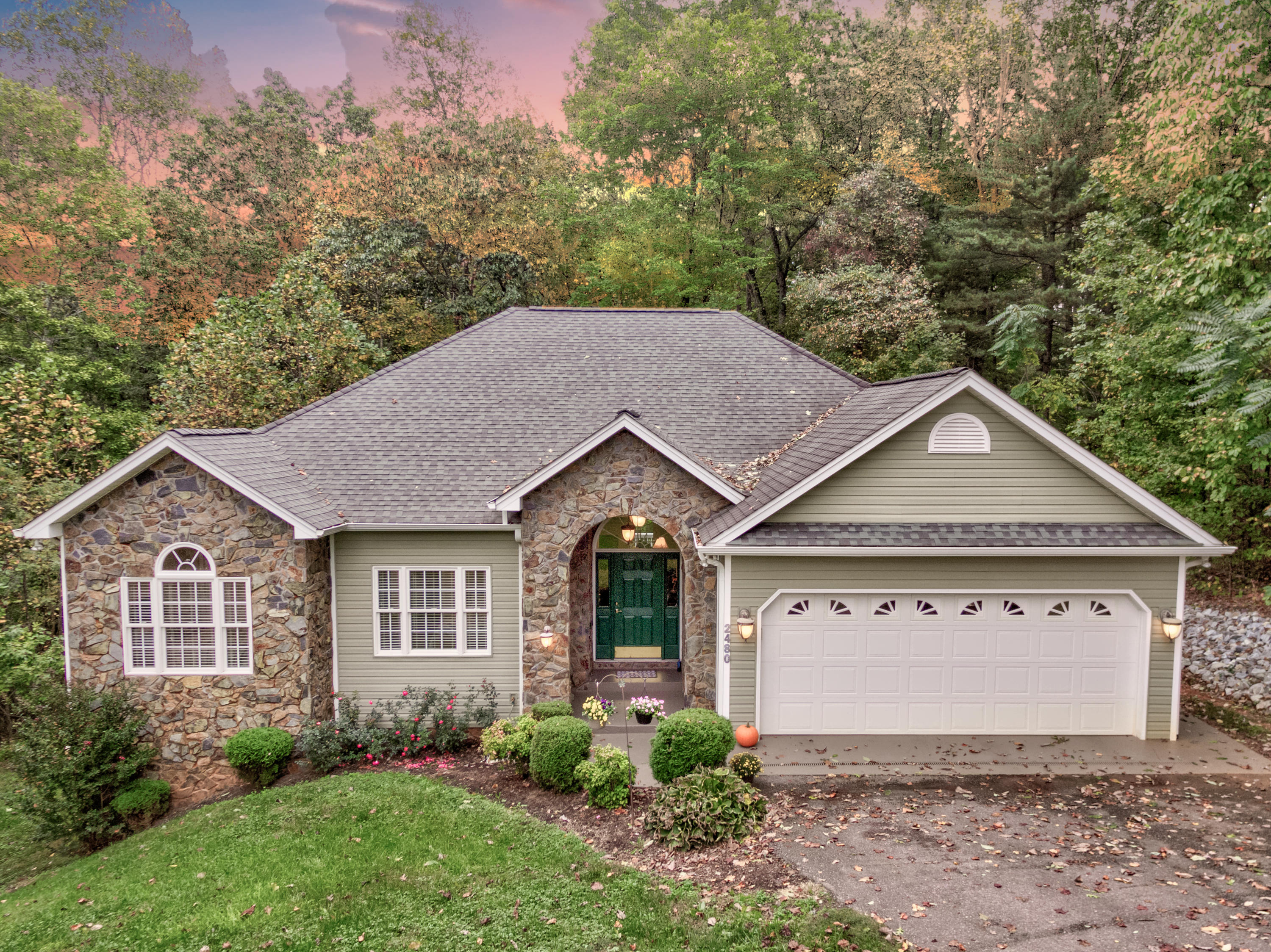 2480 Iron Ridge Road Rocky Mount, VA 24151 - Photo 2 of 38 a front view of a house with garden