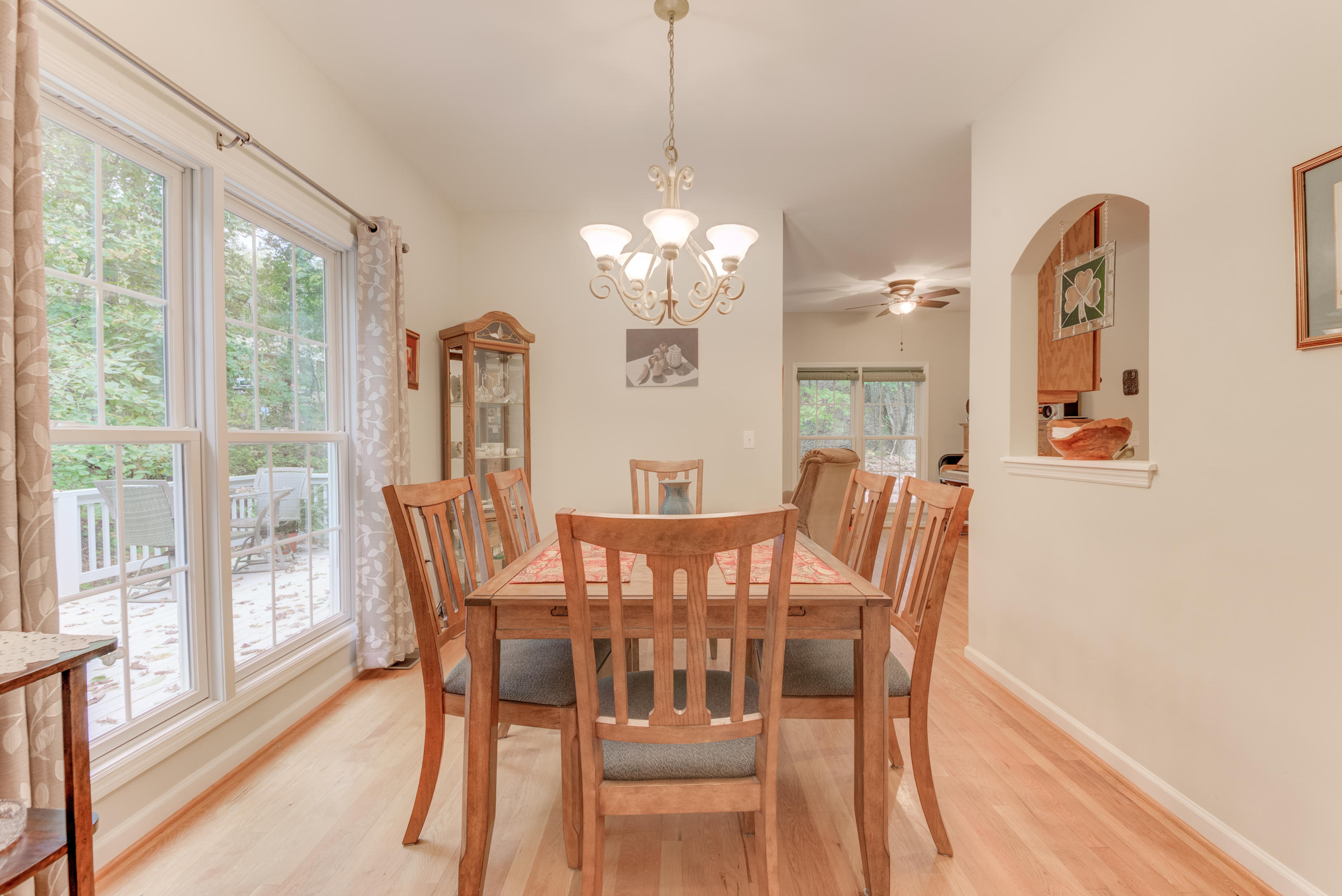 2480 Iron Ridge Road Rocky Mount, VA 24151 - Photo 20 of 38 a view of a dining room with furniture a chandelier and wooden floor