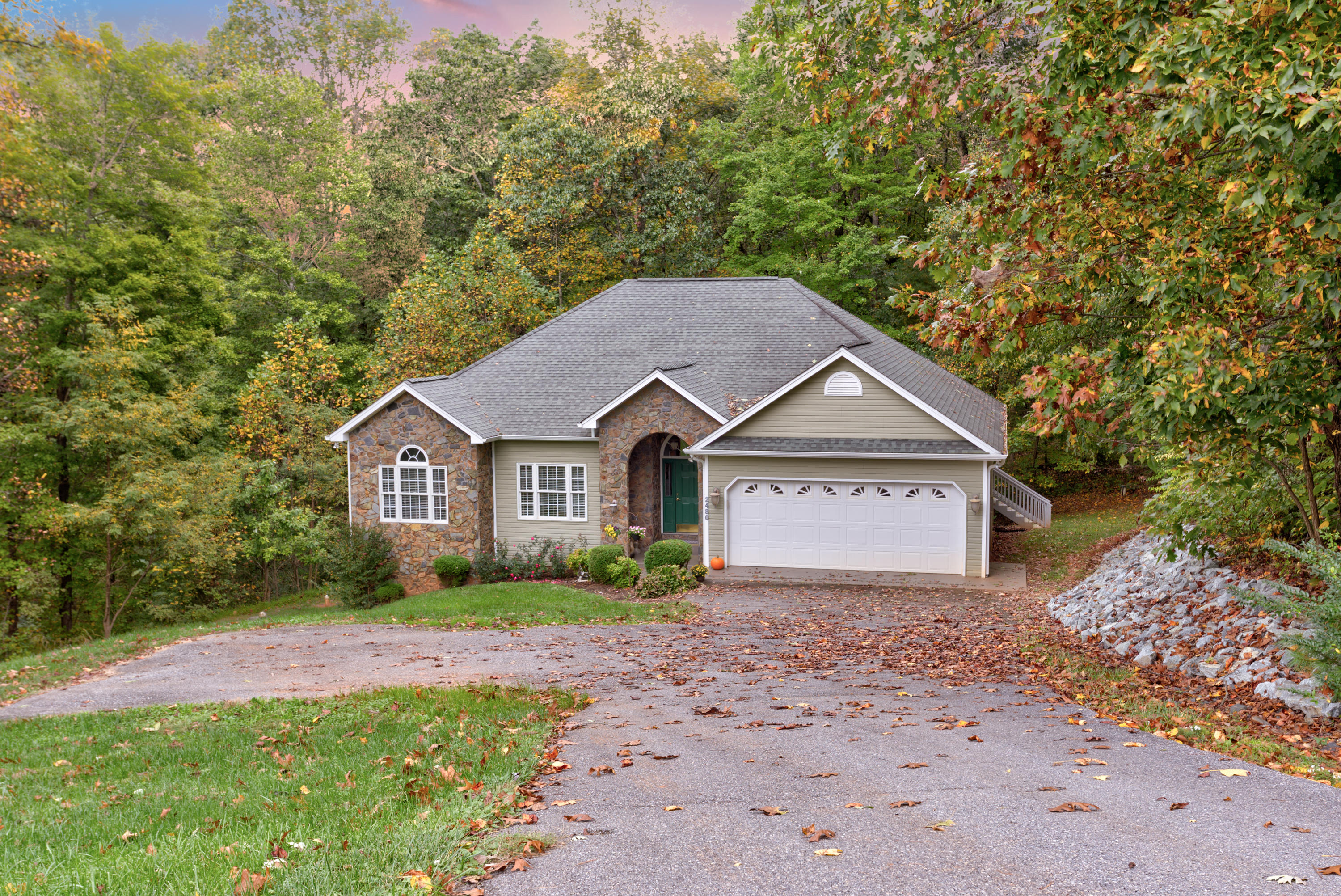2480 Iron Ridge Road Rocky Mount, VA 24151 - Photo 3 of 38 a front view of a house with a garden and yard