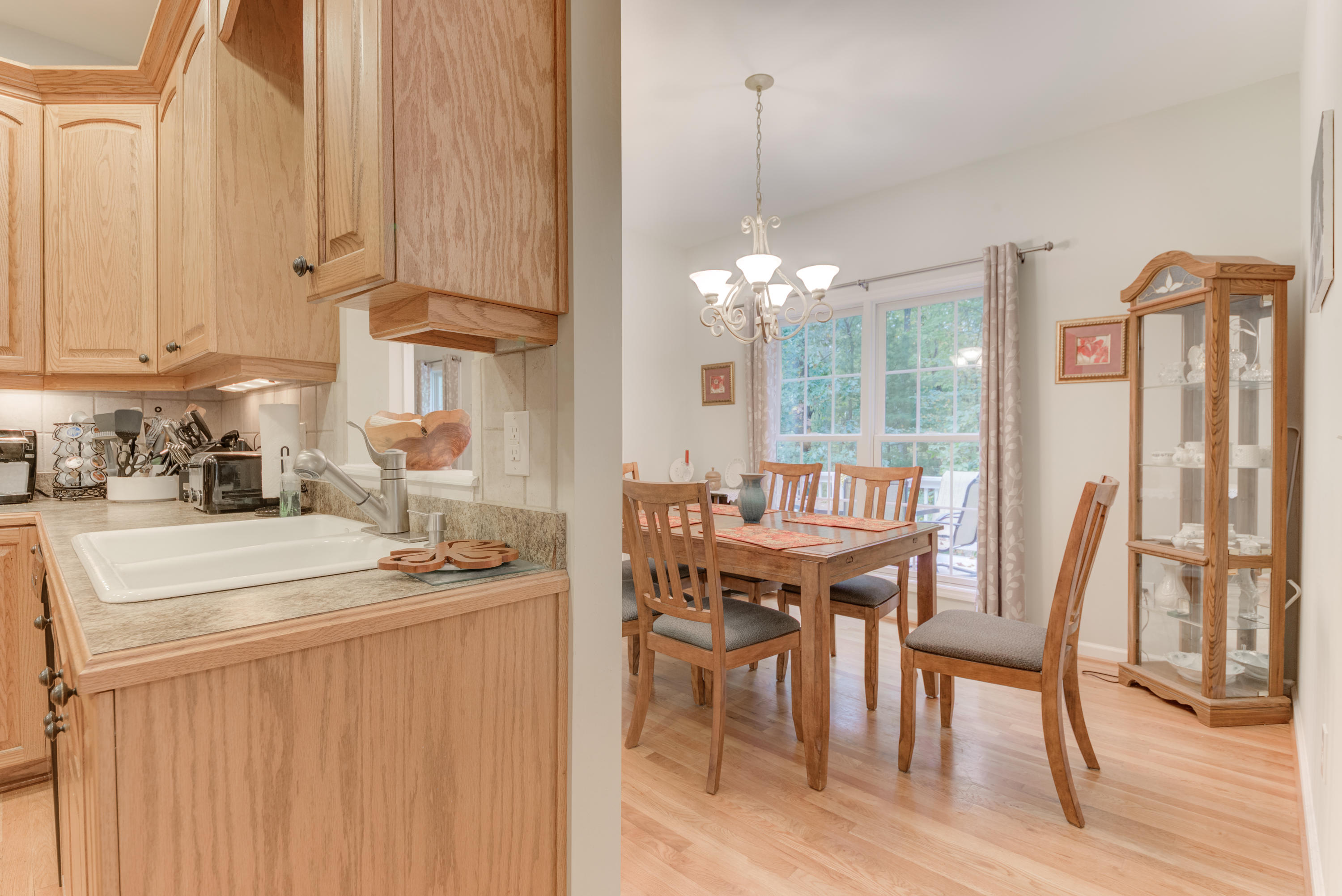 2480 Iron Ridge Road Rocky Mount, VA 24151 - Photo 21 of 38 a dining room with furniture a chandelier and wooden floor
