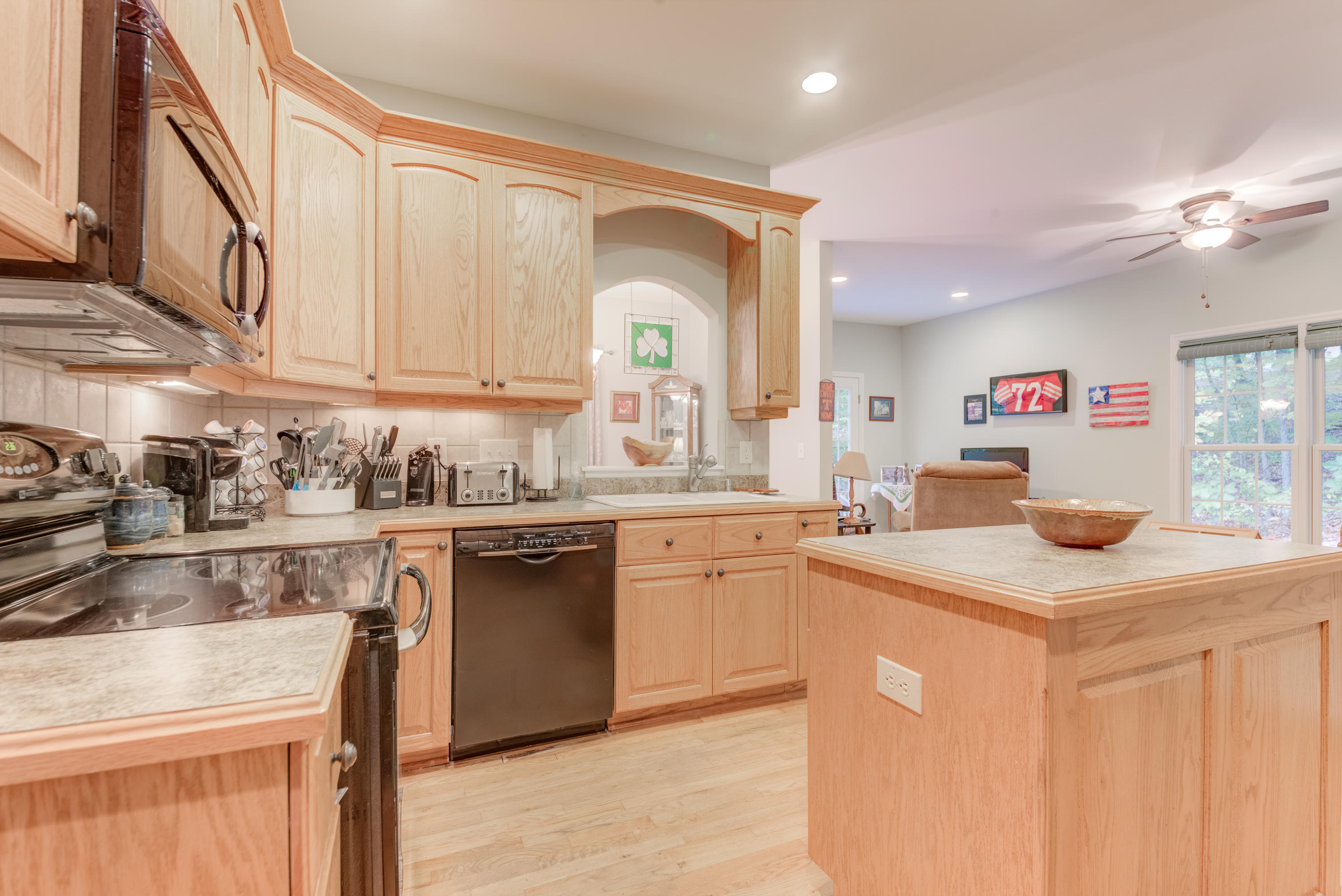 2480 Iron Ridge Road Rocky Mount, VA 24151 - Photo 23 of 38 a kitchen with granite countertop a sink and white cabinets