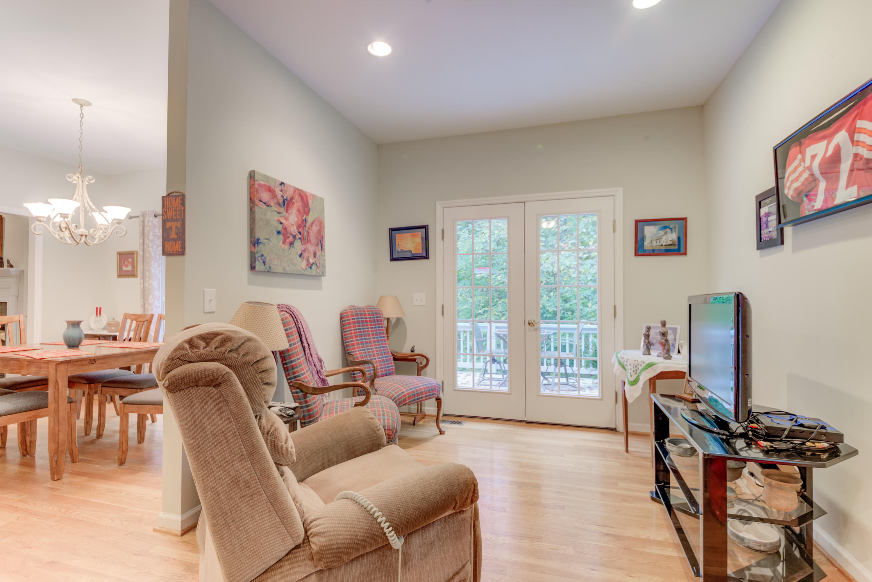 2480 Iron Ridge Road Rocky Mount, VA 24151 - Photo 27 of 38 a living room with furniture a desk and a flat screen tv