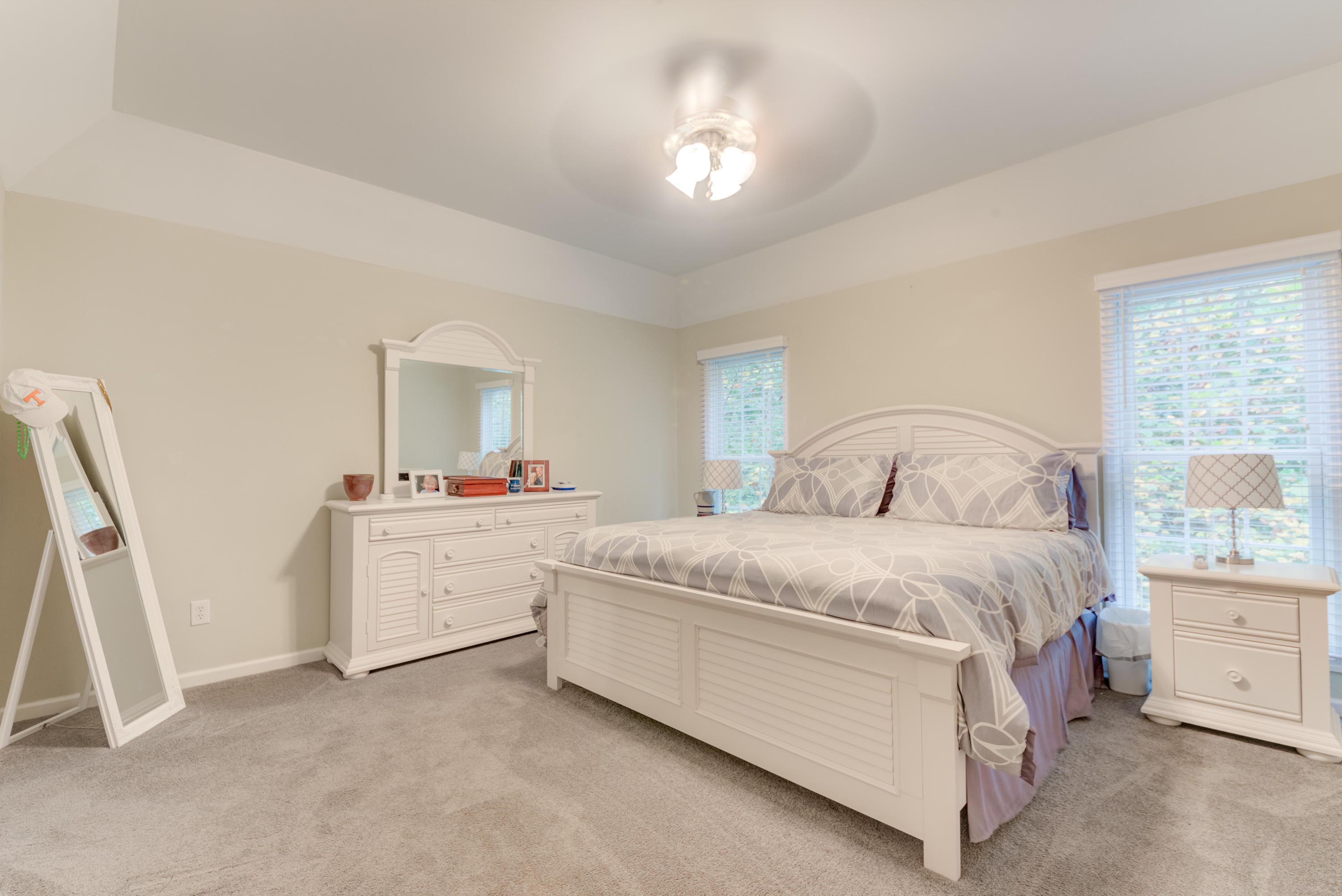 2480 Iron Ridge Road Rocky Mount, VA 24151 - Photo 28 of 38 a spacious bedroom with a bed a couch and dresser