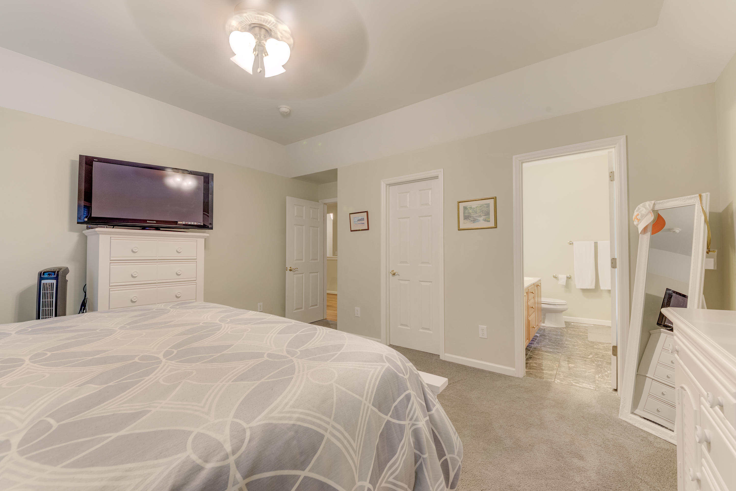 2480 Iron Ridge Road Rocky Mount, VA 24151 - Photo 29 of 38 a bedroom with a bed and a flat screen tv