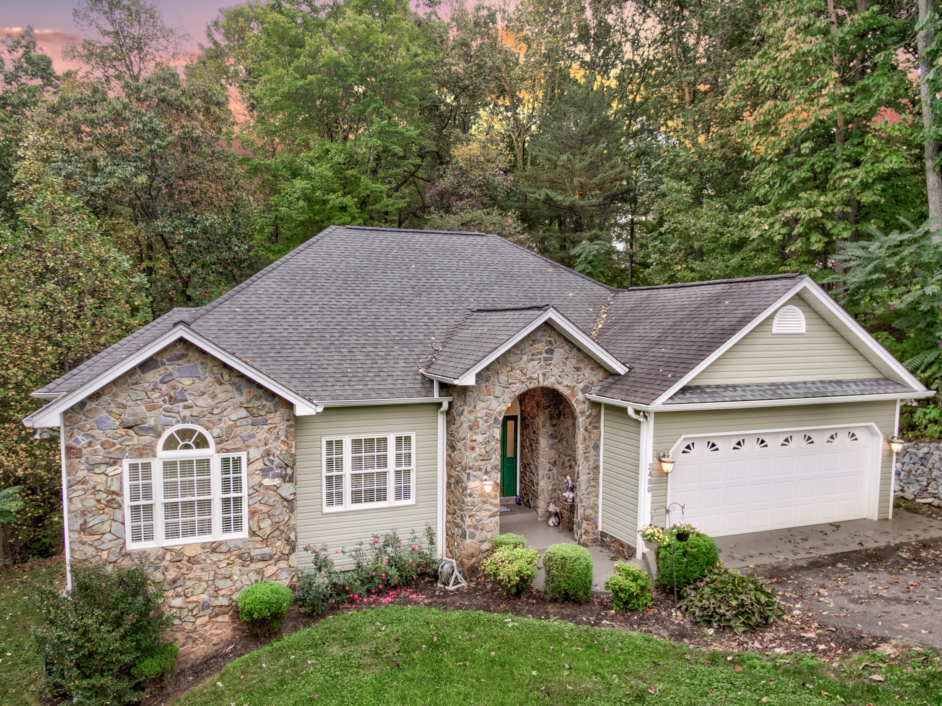 2480 Iron Ridge Road Rocky Mount, VA 24151 - Photo 4 of 38 a view of a house with a yard plants and large tree