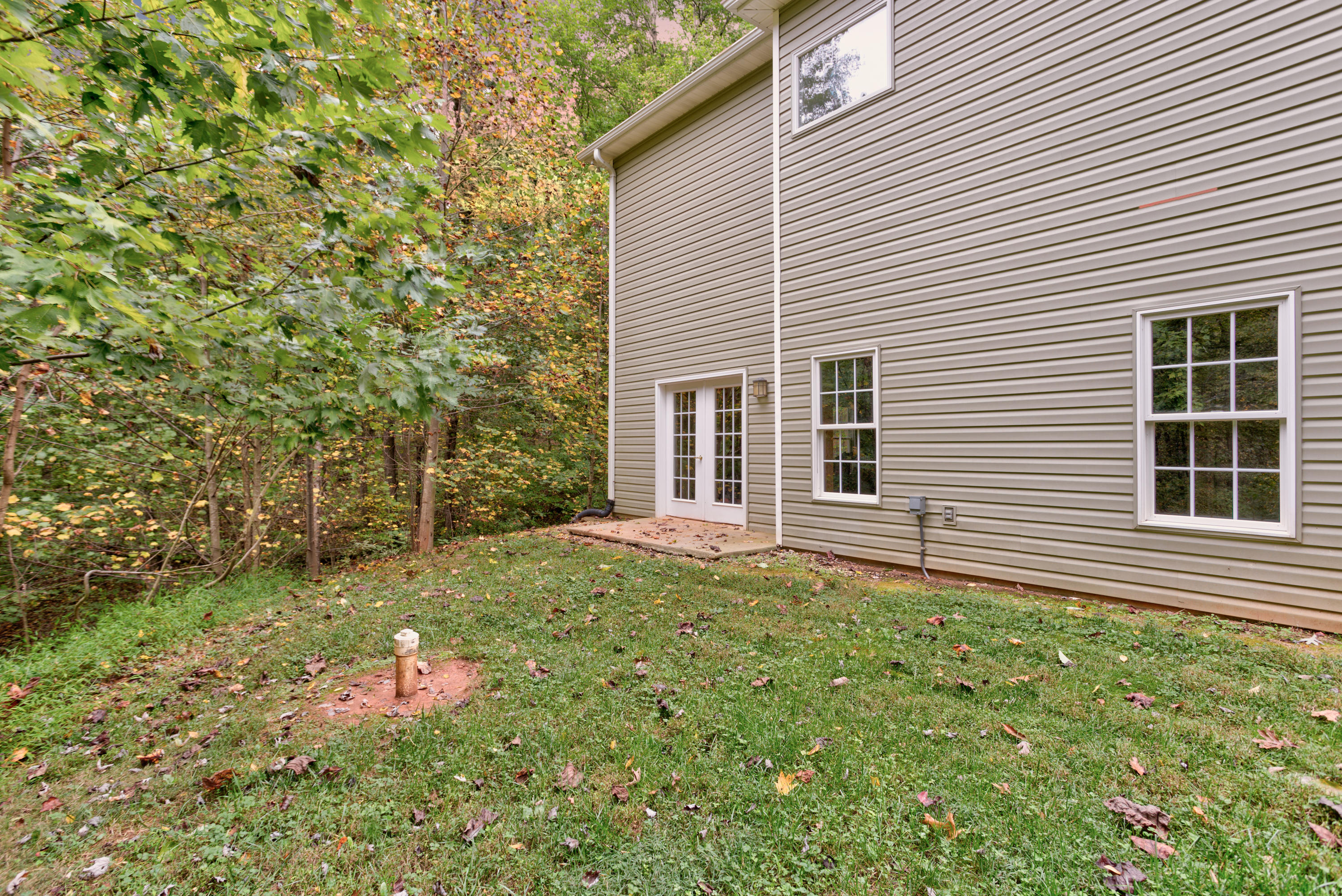 2480 Iron Ridge Road Rocky Mount, VA 24151 - Photo 7 of 38 a backyard of a house with table and chairs
