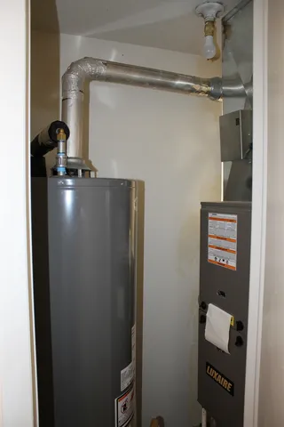 a view of a house with a yard and garage