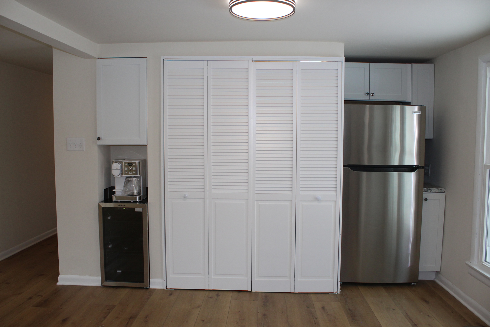 324 Sumac Street Wilmington, IL 60481 - Photo 9 of 23 a view of a kitchen with refrigerator and wooden floor