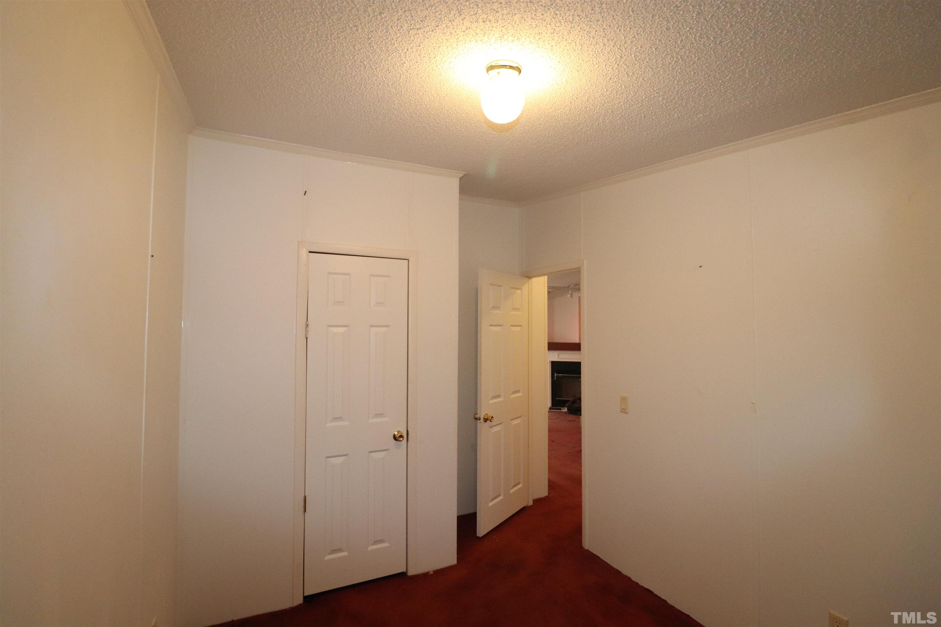 12405 Selma Road Middlesex, NC 27557 - Photo 18 of 22 an empty room with wooden floor and windows