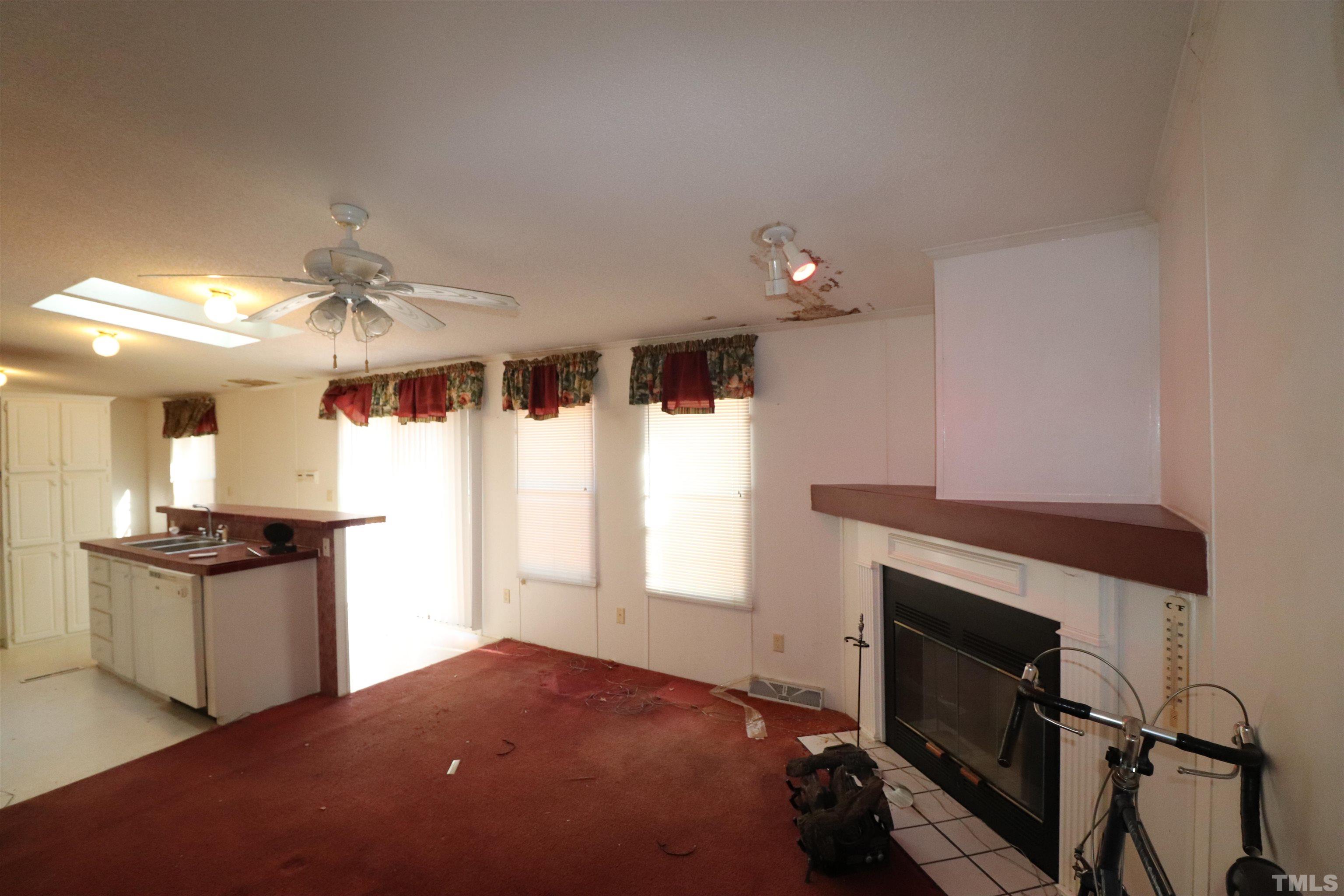 12405 Selma Road Middlesex, NC 27557 - Photo 9 of 22 a kitchen with granite countertop a stove and a refrigerator