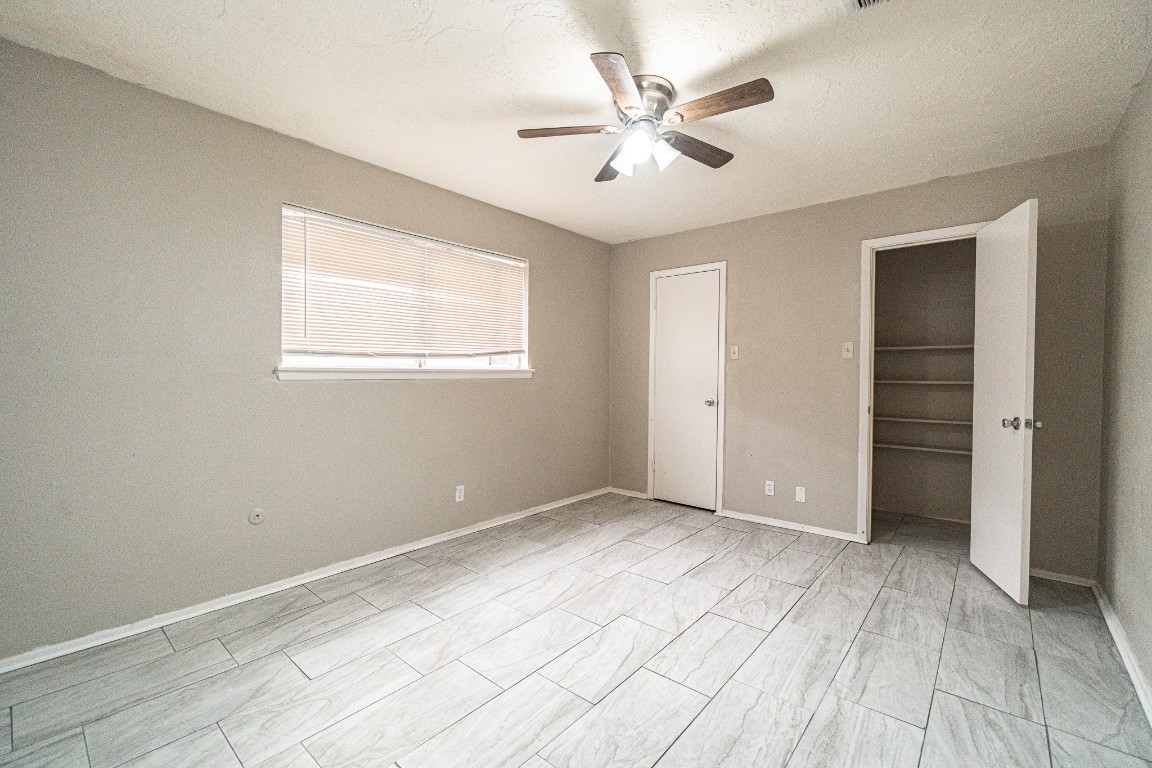 7406 Baneway Drive Houston, TX 77072 - Photo 16 of 22 a view of an empty room with a window
