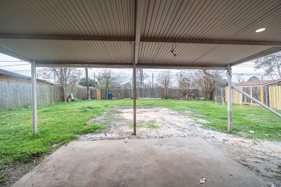 7406 Baneway Drive Houston, TX 77072 - Photo 20 of 22 a view of a house with backyard and porch