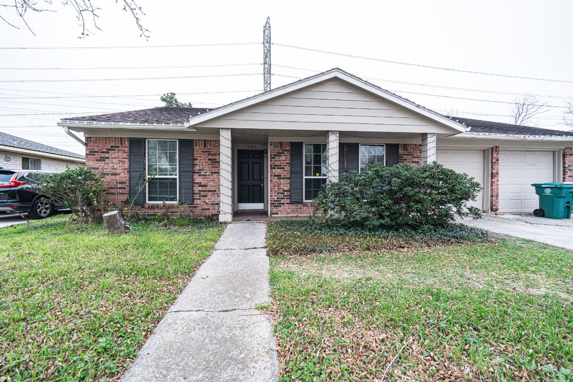 7406 Baneway Drive Houston, TX 77072 - Photo 22 of 22 front view of a house and a yard