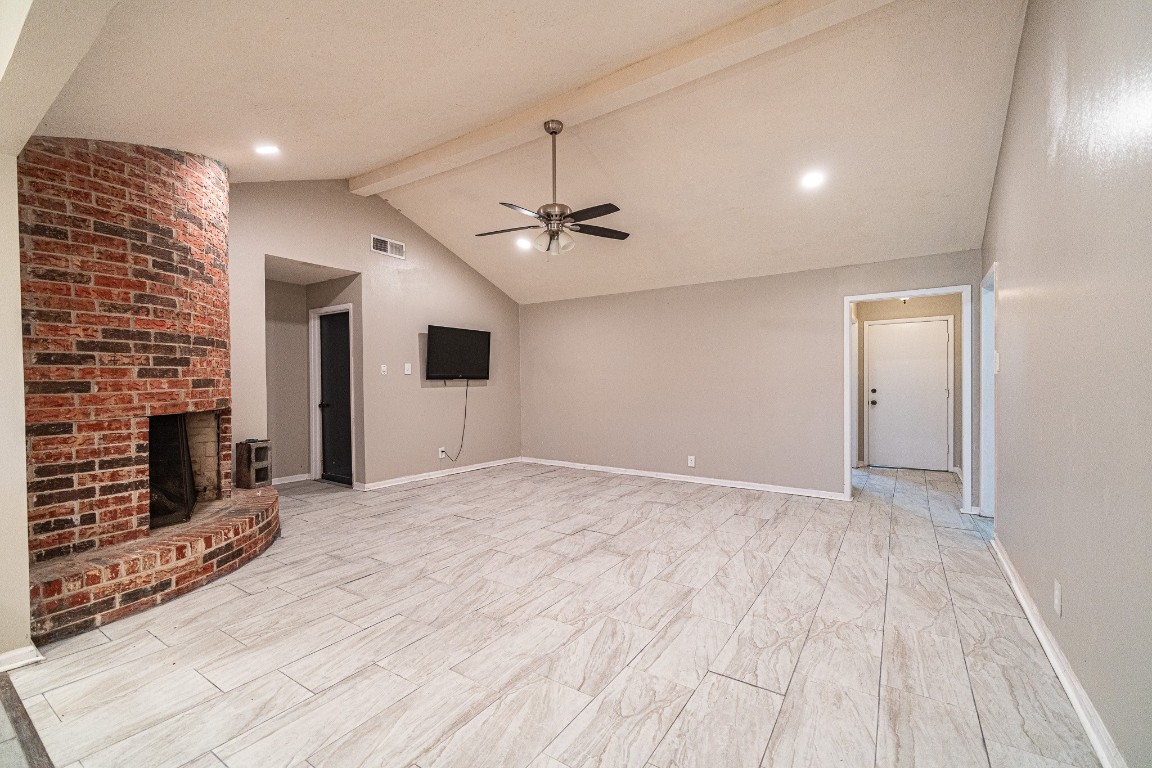 7406 Baneway Drive Houston, TX 77072 - Photo 9 of 22 a view of an empty room with a fireplace