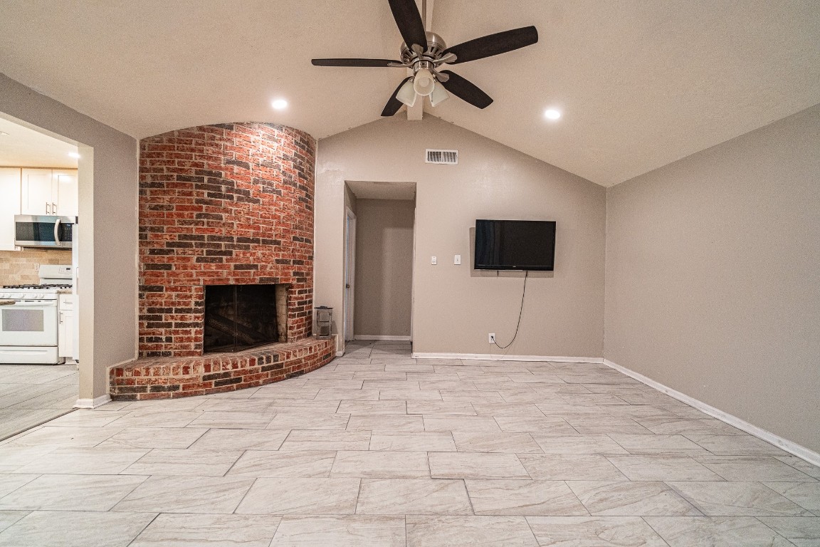 7406 Baneway Drive Houston, TX 77072 - Photo 10 of 22 a view of an empty room with a fireplace