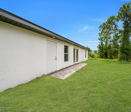 a backyard of a house with lots of green space