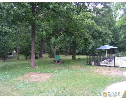 104 Pleasant Valley Road Old Bridge, NJ 08857 - Photo 2 of 7 a backyard of a house with lots of green space