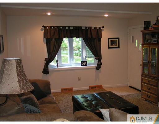 104 Pleasant Valley Road Old Bridge, NJ 08857 - Photo 4 of 7 a living room with furniture and a window