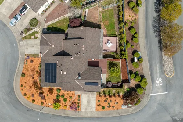 an aerial view of a house with a swimming pool