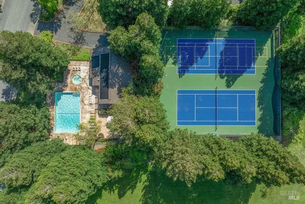 a view of a swimming pool with a patio