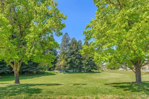 a view of swimming pool with outdoor seating and yard