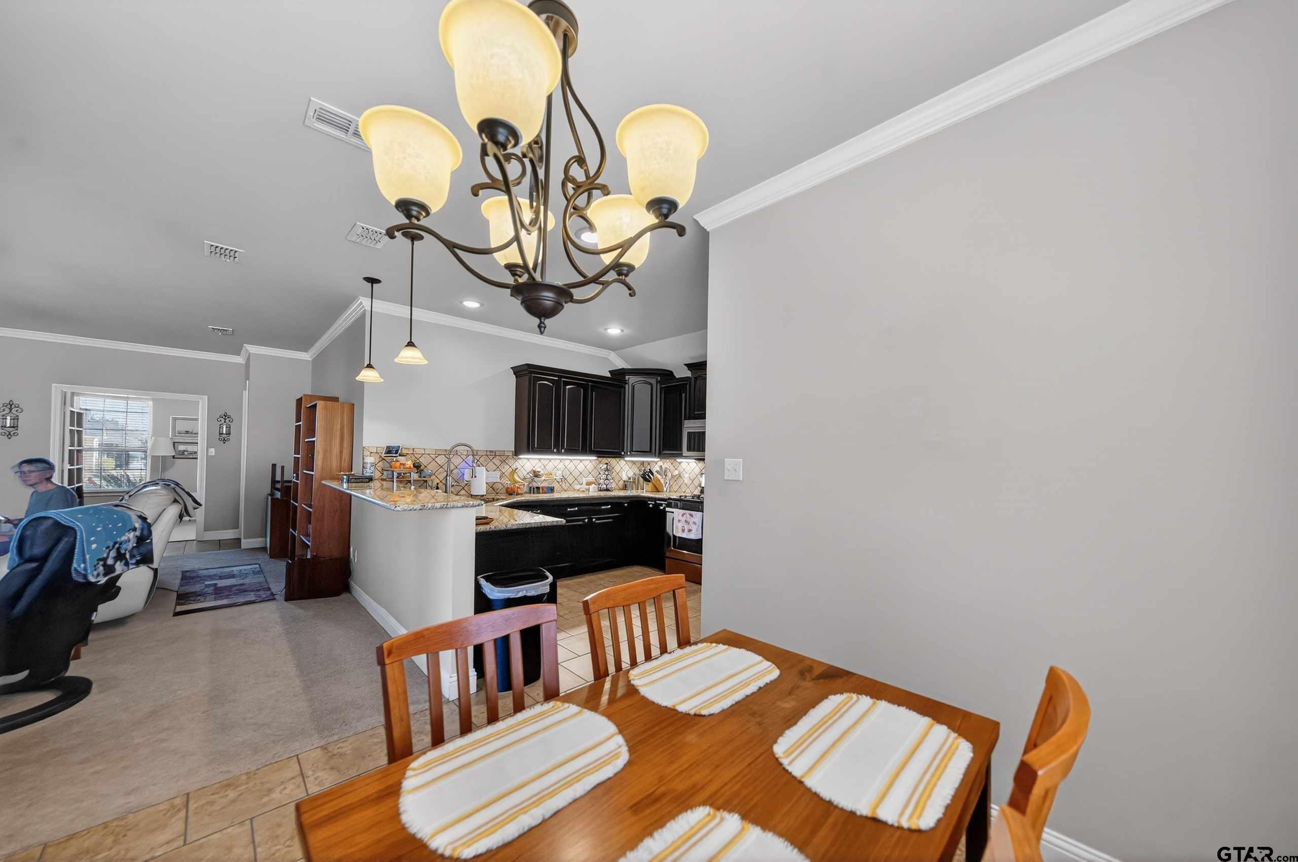 5830 Thompson Place Tyler, TX 75707 - Photo 12 of 35 a view of a dining room with furniture