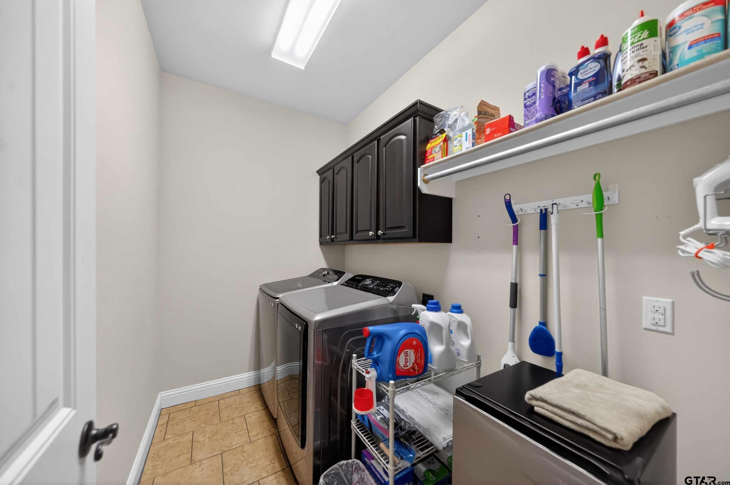 5830 Thompson Place Tyler, TX 75707 - Photo 18 of 35 a room with storage and utility