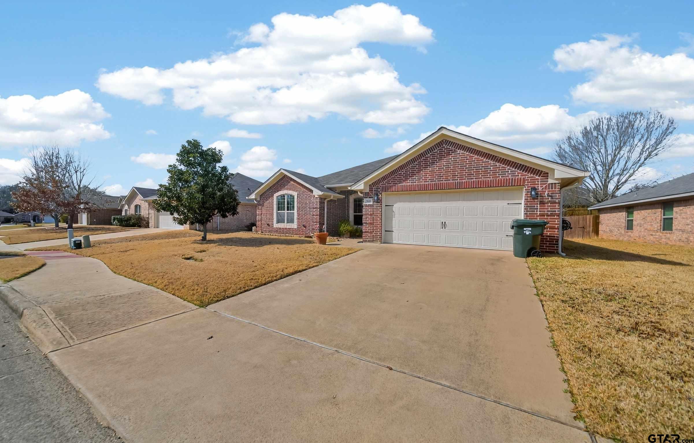 5830 Thompson Place Tyler, TX 75707 - Photo 2 of 35 a view of the house with a yard