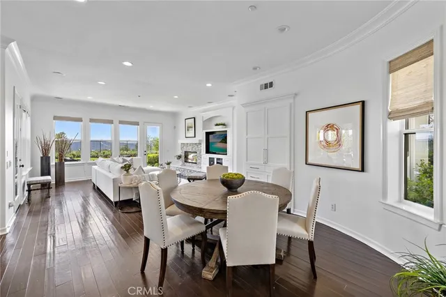 a kitchen with stainless steel appliances granite countertop a sink a stove and a wooden floors