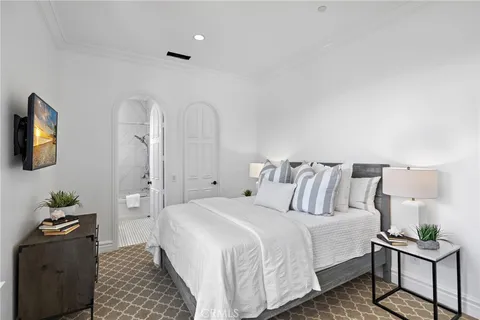 a bathroom with a double vanity sink a mirror and a bathtub