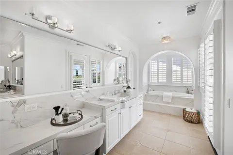 a bedroom with a bed and a chair