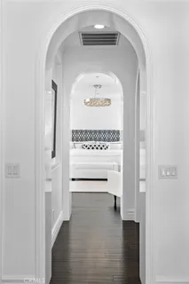 a bathroom with a sink and mirror with bathtub