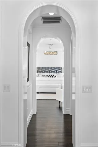 a bathroom with a sink and mirror with bathtub
