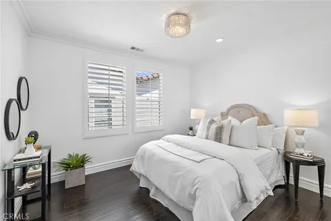 a front view of a house with swimming pool having outdoor seating