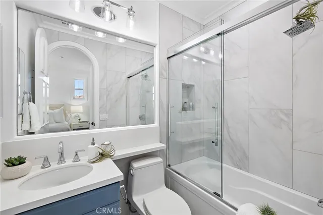 a view of a patio with couches table and chairs and potted plants