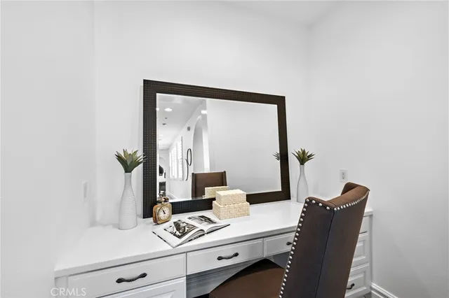 a view of a chairs and table in the garden