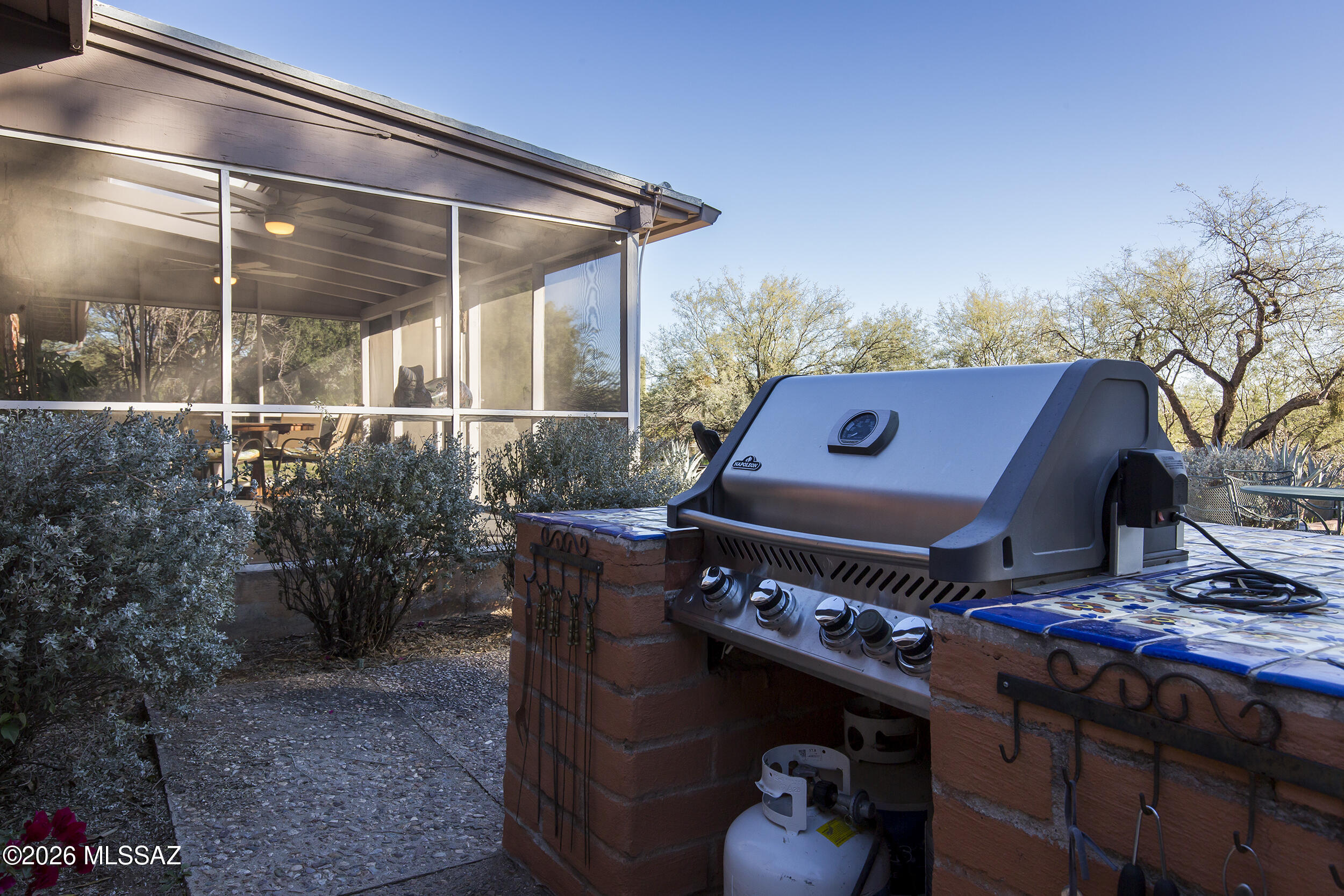 4130 East River Road Tucson, AZ 85718 - Photo 28 of 46 a side view of a house with a patio