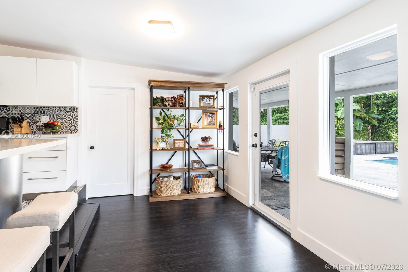6070 Southwest 25th Street Miami, FL 33155 - Photo 11 of 15 a living room with furniture and a large window