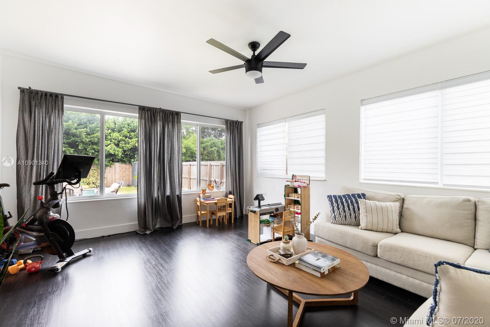 6070 Southwest 25th Street Miami, FL 33155 - Photo 12 of 15 a living room with furniture and a large window