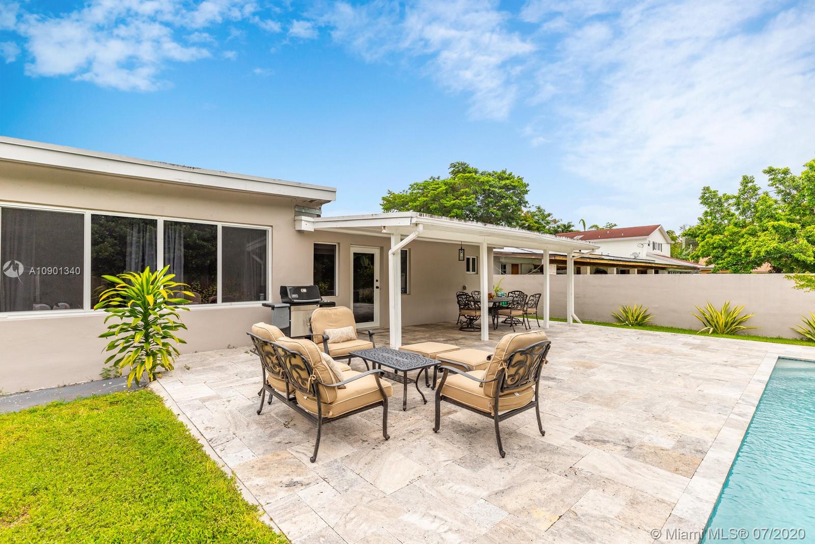 6070 Southwest 25th Street Miami, FL 33155 - Photo 15 of 15 a view of a house with backyard and sitting area